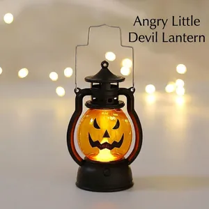Close-up of a vintage Halloween pumpkin lantern with black base and silver handle