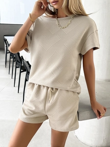 Detailed knit texture of beige summer two-piece short set with drawstring waistband