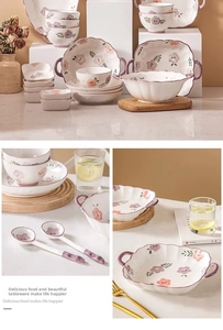 Detail of floral ceramic tableware set including bowls and plates with purple accents
