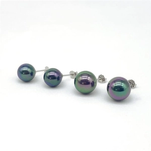 Detail of S925 sterling silver stud earrings featuring peacock green shell pearls in two sizes