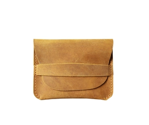 Close-up of handmade brown crazy horse leather card holder with vintage stitching details