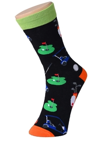 Close-up of black cotton socks with golf theme patterns and green cuff on foot