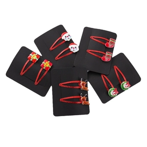 Christmas hair clip set featuring Santa Claus, reindeer, and resin charms for holiday parties