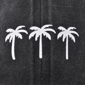 Distressed black cotton baseball cap with white coconut tree embroidery on the front
