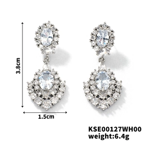 Detail view of silver drop earrings with zircons showing dimensions of 3.8cm by 1.5cm