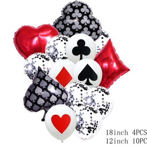Detail of red and black poker themed balloons set with spade and heart suit patterns
