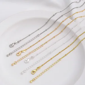 Polished 14K gold plated beaded chain necklace with lobster clasp and teardrop extension