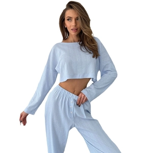 Light blue knit two-piece loungewear set featuring a crop top and high-waisted pants