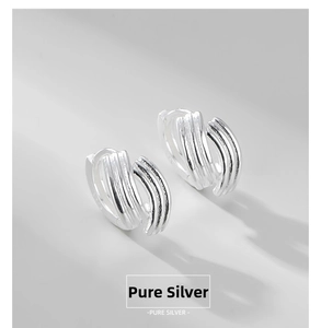 Detail of multi-layer S925 sterling silver earrings with polished finish and sleek lines