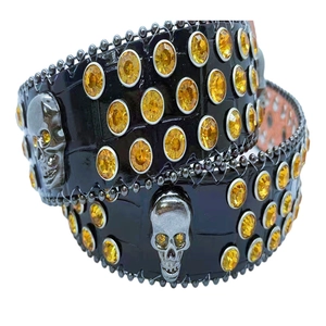 Black crocodile leather belt with yellow rhinestones and metal skull ornaments