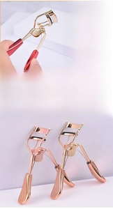 Detail of metal eyelash curler with soft silicone pad and ergonomic wide opening design