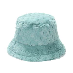 Detailed texture of thick mint green plush faux fur on a winter bucket hat surface