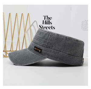 Detail of gray washed cotton cadet cap with metal Sport badge on stylish display