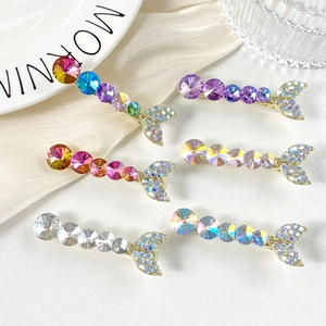 Macro view of crystal mermaid tail hair clips in various colors with rhinestone details