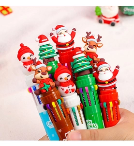Detail of Christmas multi-color ballpoint pens with Santa and reindeer cartoon toppers