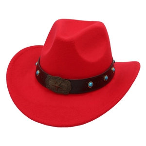 Detailed shot of red felt cowboy hat with turquoise beads and bronze star buckle decor