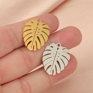 Polished stainless steel monstera leaf charms in gold and silver finish for DIY jewelry