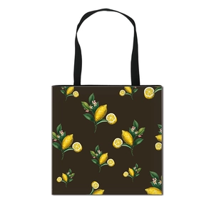 Foldable canvas tote bag featuring lemon fruit illustration with large storage capacity