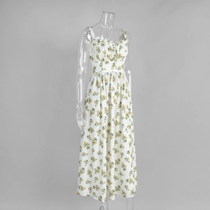 Detail of yellow lemon floral print and ruffle neckline on a white summer midi dress