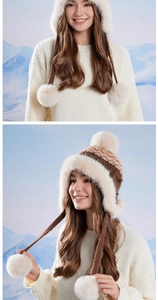 Close-up of Fair Isle knit trapper hat with faux fur lining and white pom-pom details
