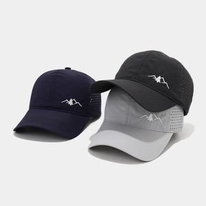Detail of breathable eyelets and mountain embroidery on quick-dry baseball caps