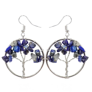 Detail of handmade silver wire tree of life earrings with blue lapis lazuli stones