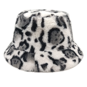 Detailed close-up of fluffy leopard print faux fur texture on a warm winter bucket hat