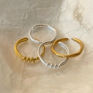Set of 925 sterling silver knotted rings in gold and silver finish with adjustable bands