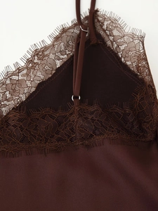 Close-up of lace edge and adjustable strap on deep brown silk satin camisole top