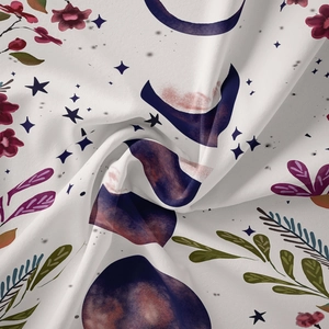 Close-up of bohemian floral tapestry fabric with moon phase and star patterns