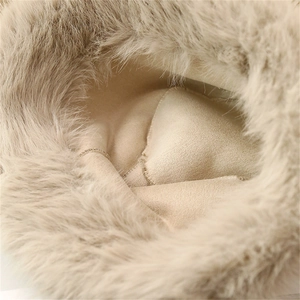 Close-up detail of faux fox fur winter hat with soft lining and thick plush brim