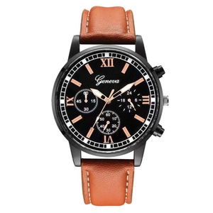 Dettaglio orologio da uomo nero opaco con numeri in oro rosa e cinturino in pelle marrone