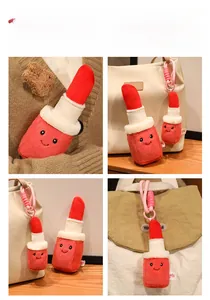 Lipstick plush charm keychain on bags and sweater, featuring cute embroidered facial expressions