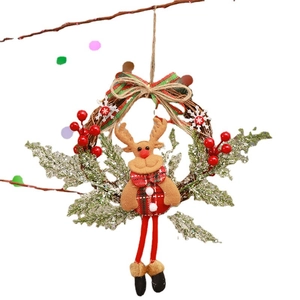 Christmas reindeer wreath with brown rattan, red berries and plaid fabric doll