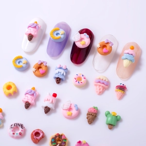 Macro shot of colorful resin food charms like donuts and ice cream for nail art design