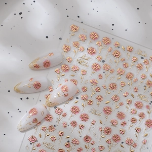 3D floral nail stickers with gold embossed pink roses and stylish white manicure samples