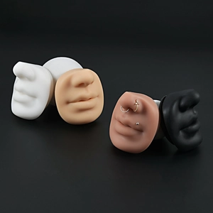 Detailed set of silicone nose and mouth models in four skin tones for piercing display