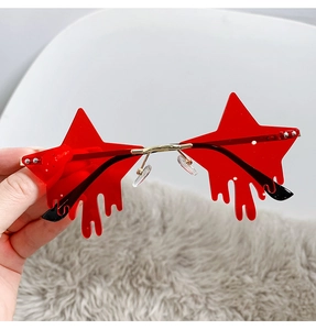 Detail of red star-shaped rimless sunglasses with unique dripping water effect lenses