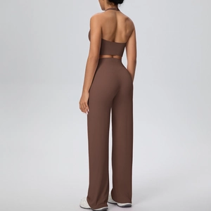 Detail view of the halter neck sports top and wide-leg yoga pants from the back side