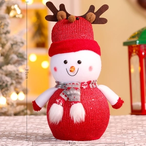 Close-up of 30cm red Christmas snowman ornament with knitted texture and deer antlers