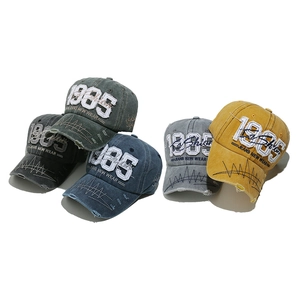 Vintage washed denim baseball cap with 1985 embroidery in multiple retro colors