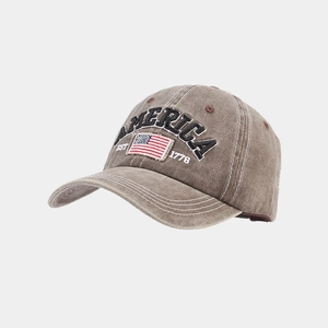 Detailed embroidery of America text and US flag on washed vintage baseball cap