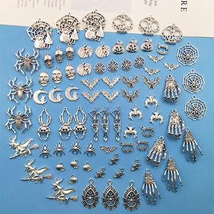 Macro detail of assorted antique silver Halloween charms for DIY jewelry making