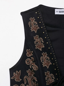 Detailed embroidery and gold rivets on black vintage faux suede vest for women