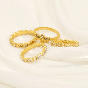18K gold plated stainless steel ring set with sparkling zircons on white silk background