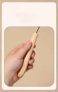 Ergonomic wooden handle of the cat feather wand teaser tool providing a comfortable grip