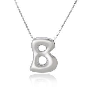 Detailed close-up of a silver letter B pendant on a delicate box chain necklace