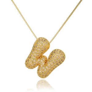 Detailed close-up of golden bubble letter W pendant necklace with champagne zircon stones