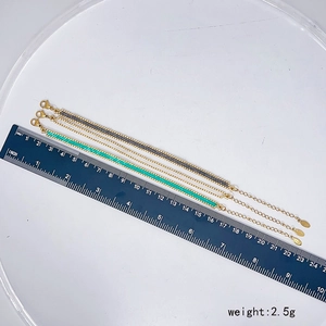 Detailed view of grey and teal bead bracelets with a ruler showing size and 2.5g weight