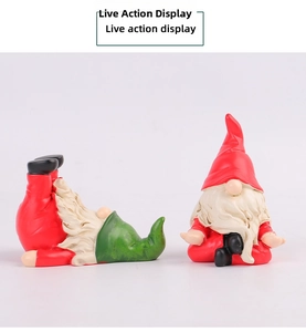 Detailed view of hand-painted resin Christmas gnomes in sitting and lying poses